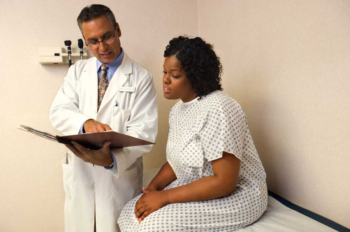 Doctor going over patient safety during clinical trial